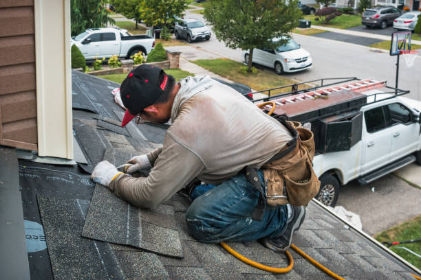 Professional Roofing technician working in Westhampton Beach, NY